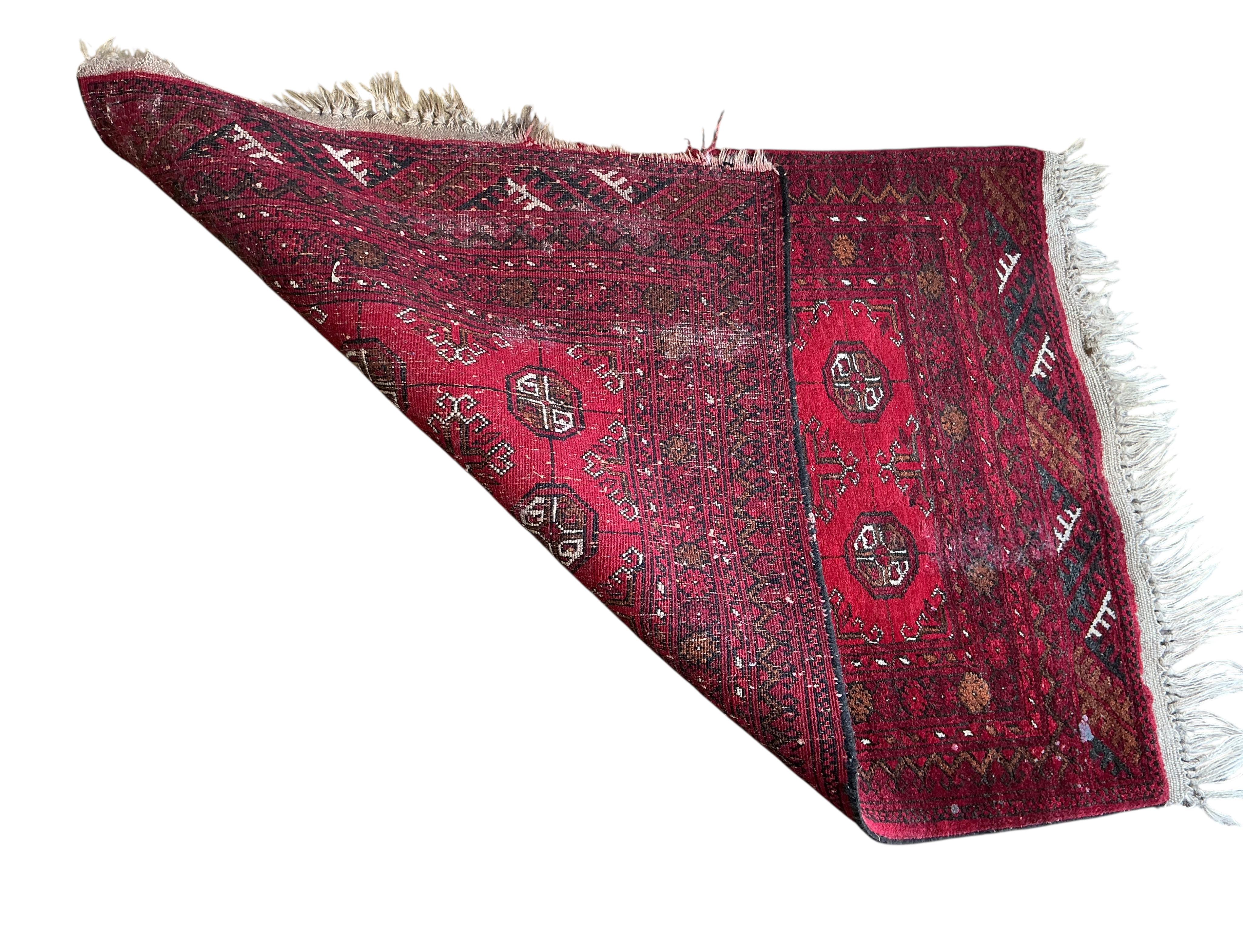 A Hamadan red ground rug, 176 x 128cm together with a smaller Bokhara mat